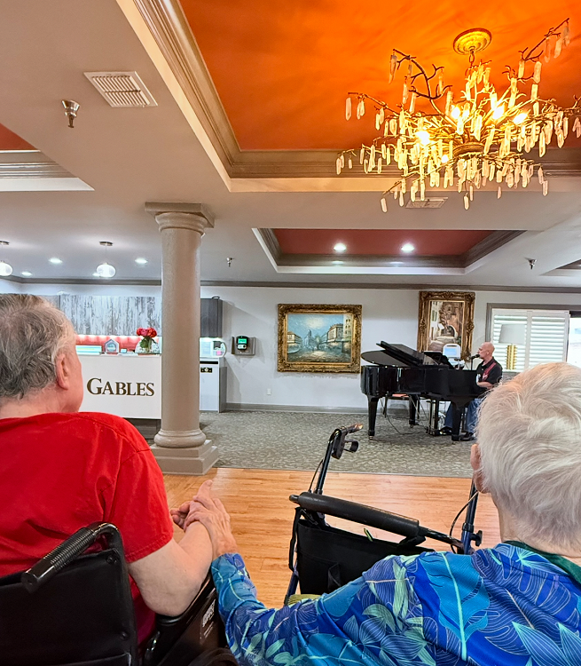 couple listens to a piano performance