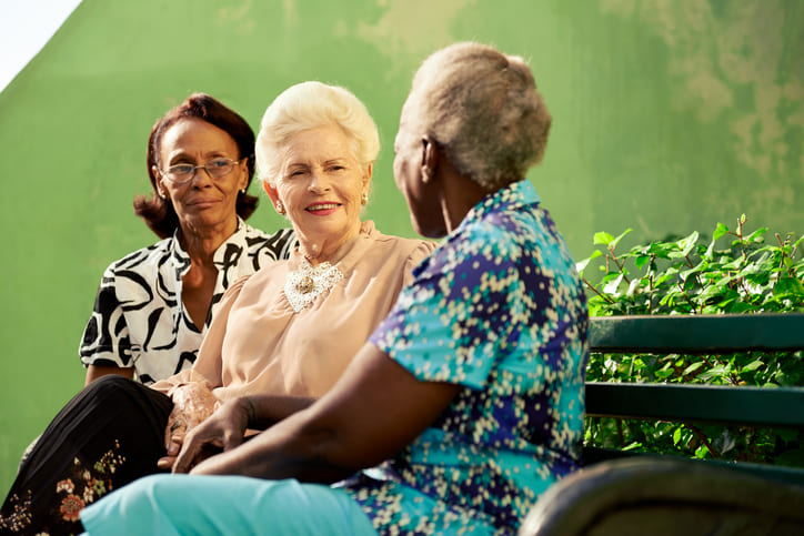 Three elderly women are talking in a park in Shreveport, LA