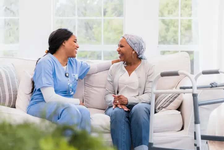 Assisted living nurse bonds with her senior patient at the gables assisted living